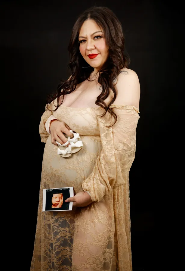 Maternity portrait in a lace gown
